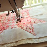 Step 1: As each block arrives.....cut a piece of batting a smidge larger than your quilt block.  Baste.  Then start quilting.